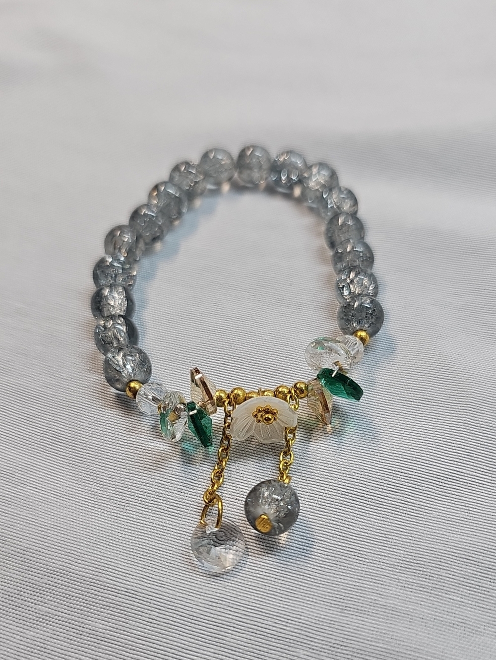 Gold-Accent Crystal Beaded Bracelet with Green and Clear Charms